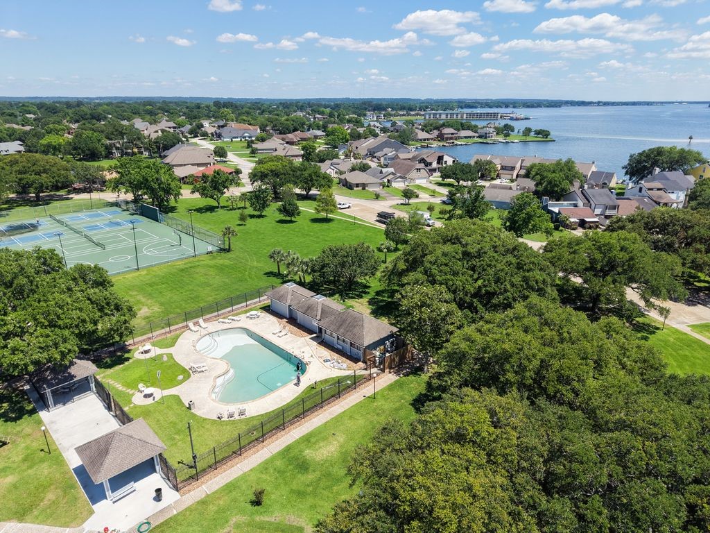 1607 Schooner Point Willis, TX 77318 - Photo 37 of 47 Residents have access to the Harbour Town Recreation Center featuring a community pool and courts.