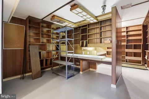 a view of walk in closet and empty room