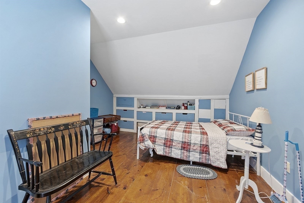 610 South Main Street Orange, MA 01364 - Photo 14 of 38 a bedroom with a bed and wooden floor