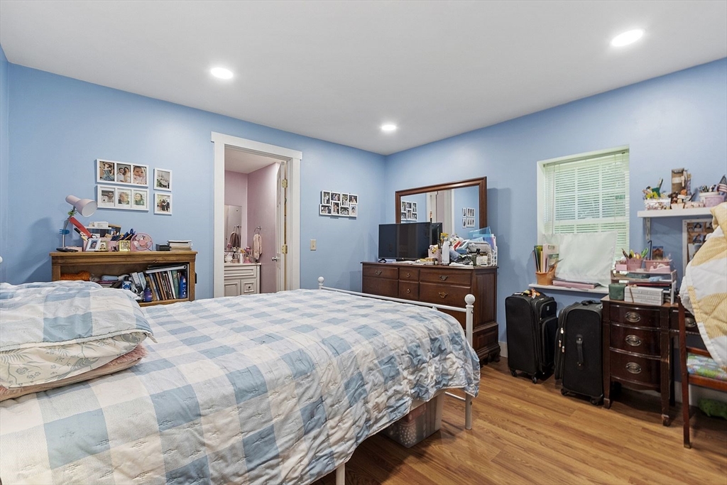 610 South Main Street Orange, MA 01364 - Photo 38 of 38 a bedroom with a bed and wooden floor