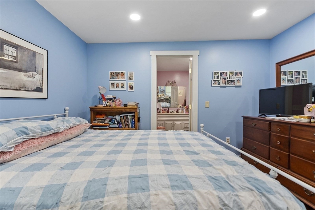 610 South Main Street Orange, MA 01364 - Photo 10 of 38 a bedroom with a bed and a flat screen tv