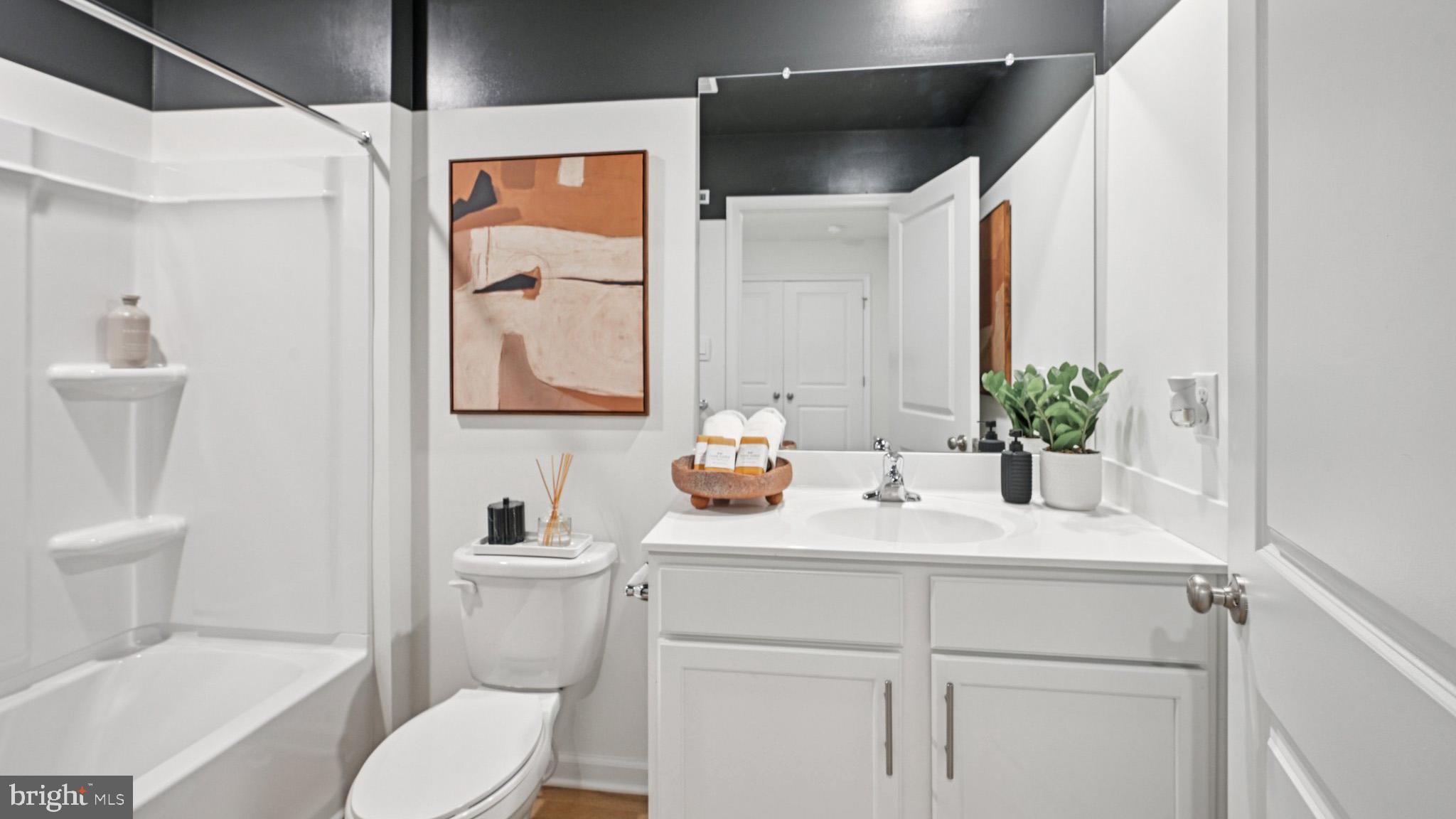 40 Robert Drive Runnemede, NJ 08078 - Photo 30 of 48 a bathroom with a sink toilet and mirror