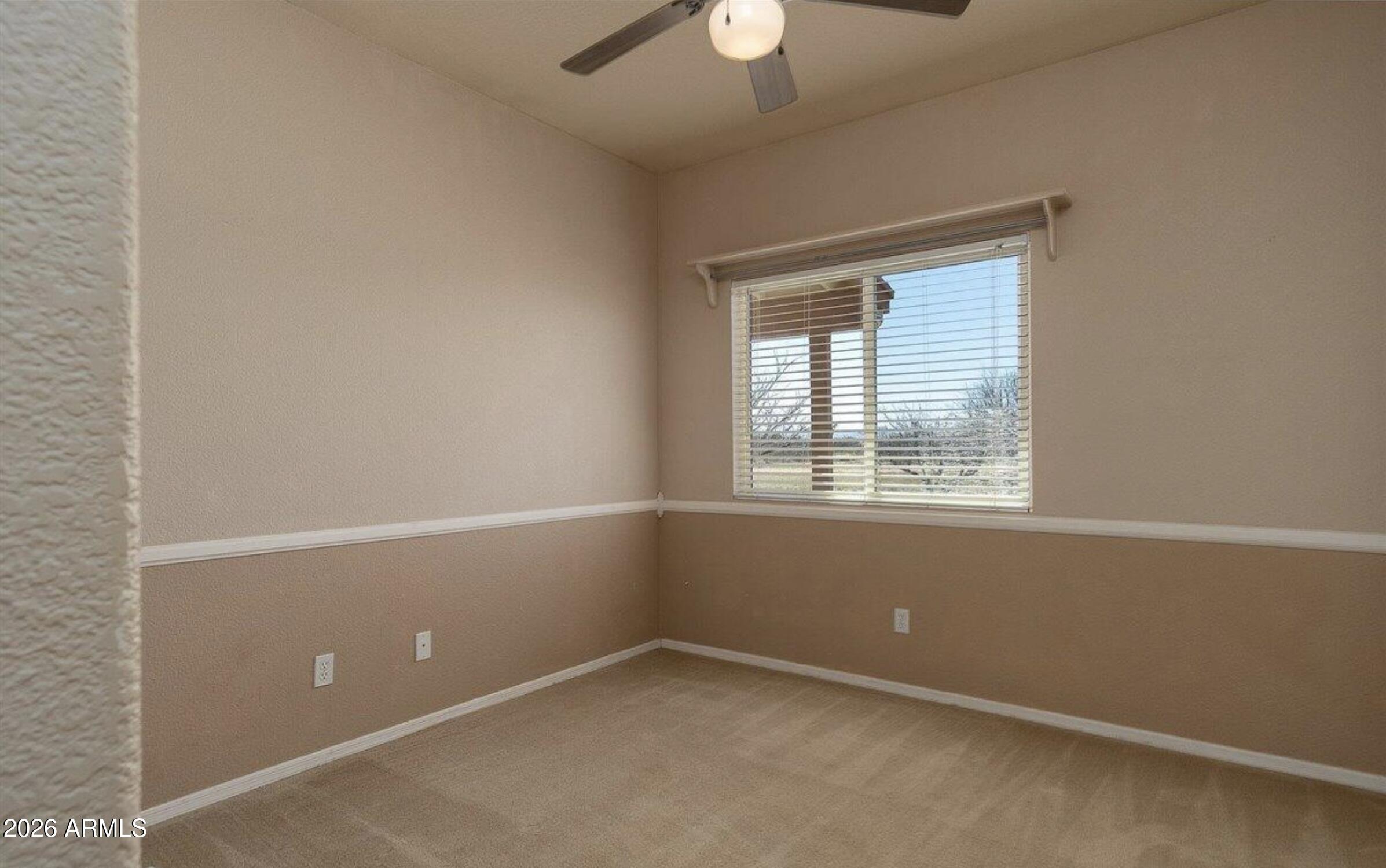 10193 East Windtalker Road Hereford, AZ 85615 - Photo 14 of 34 an empty room with a window