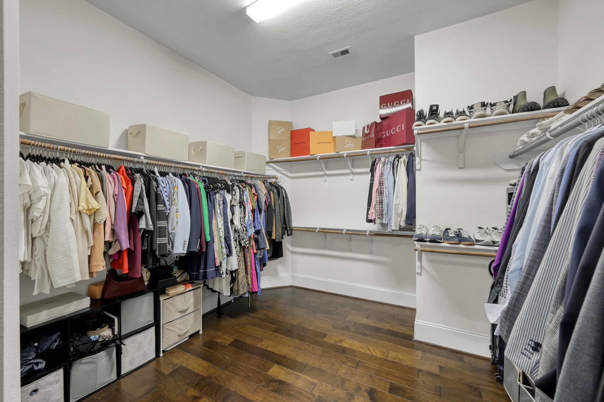 31714 Pierwood Court Spring, TX 77386 - Photo 27 of 49 a view of walk in closet with clothes and shoes