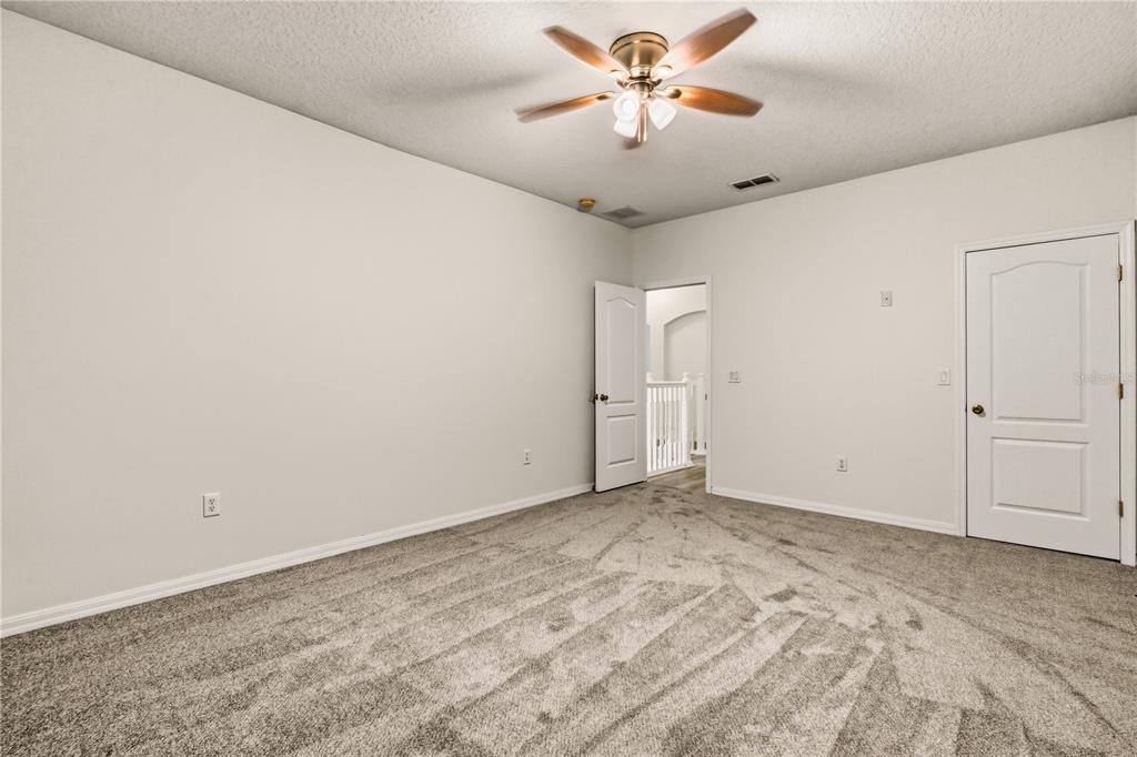 19214 Briercrest Trail Orlando, FL 32833 - Photo 13 of 47 an empty room with chandelier fan and chandelier fan