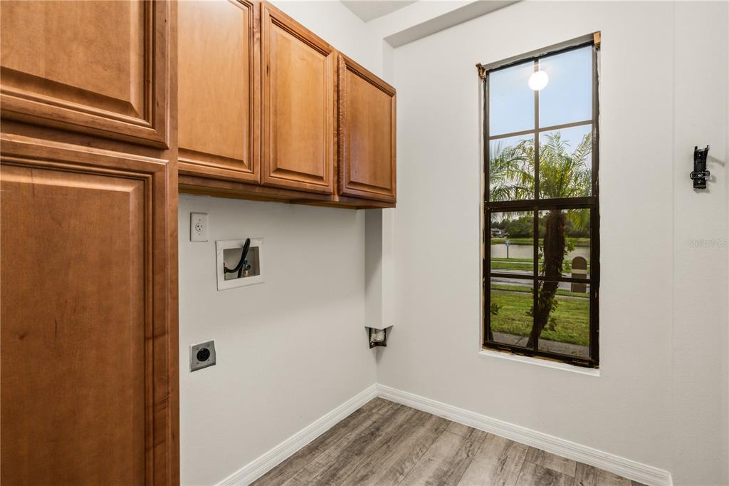 19214 Briercrest Trail Orlando, FL 32833 - Photo 16 of 47 a view of an empty room with wooden floor and a window