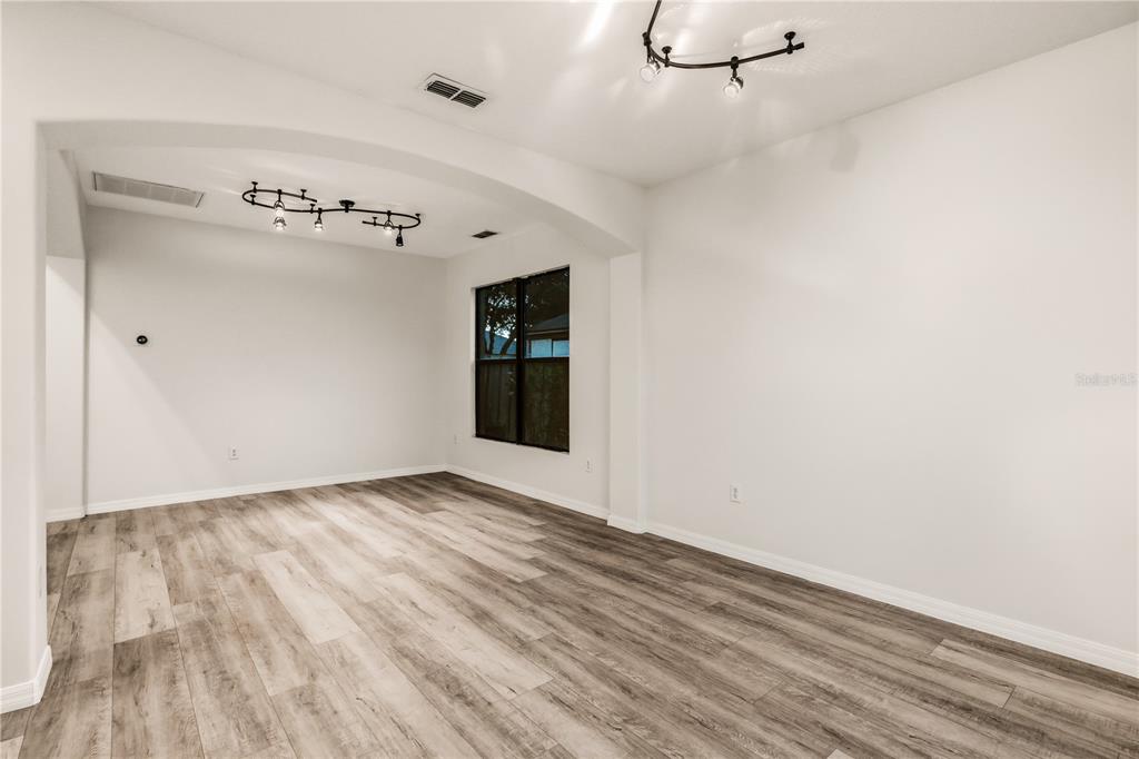 19214 Briercrest Trail Orlando, FL 32833 - Photo 3 of 47 a view of an empty room with wooden floor