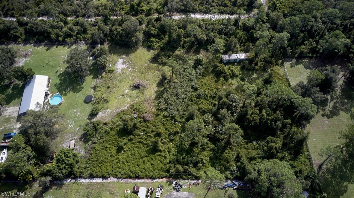 21740 Claytor Road Alva, FL 33920 - Photo 6 of 14 an aerial view of a house with a yard and lake view