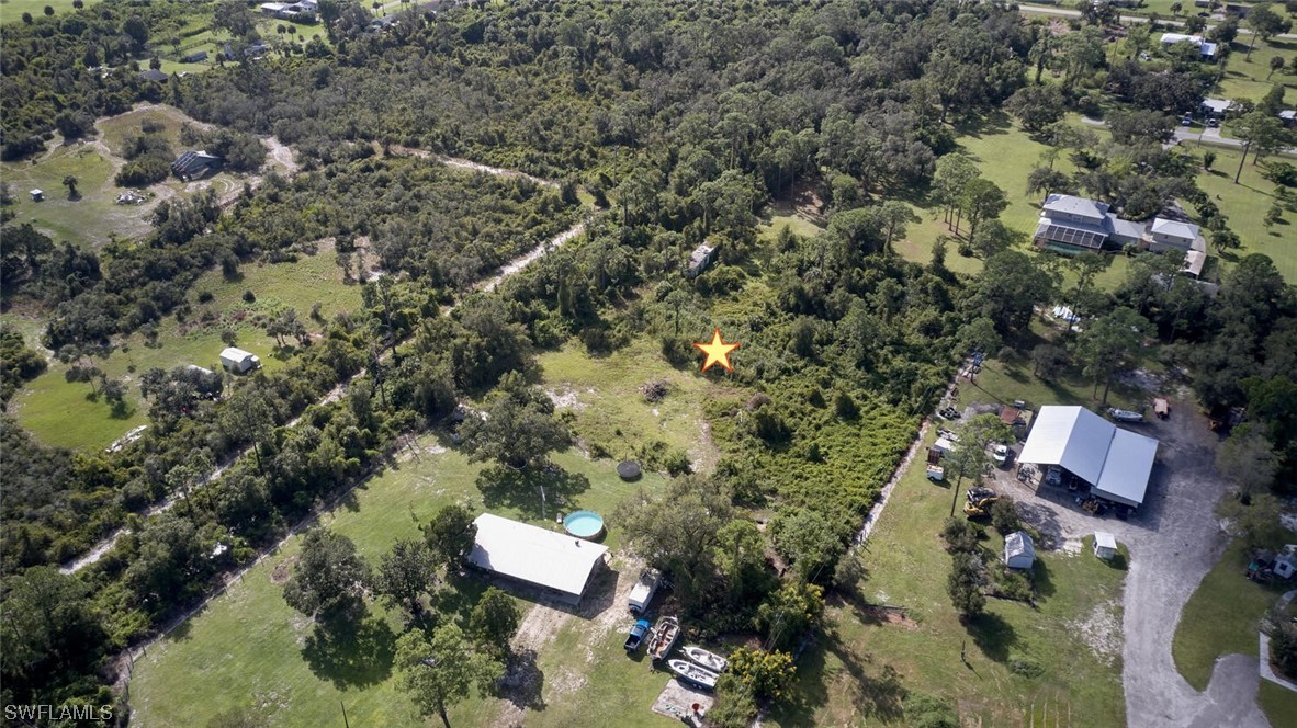 21740 Claytor Road Alva, FL 33920 - Photo 7 of 14 an aerial view of residential house with outdoor space and trees all around