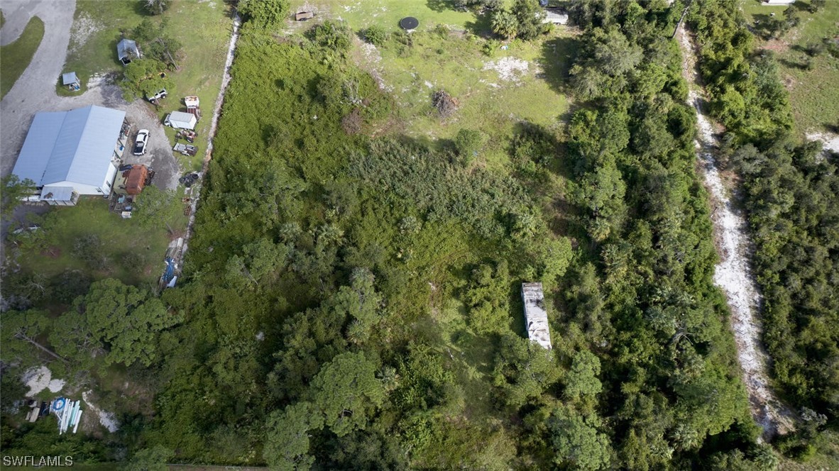 21740 Claytor Road Alva, FL 33920 - Photo 8 of 14 an aerial view of residential houses with outdoor space and trees