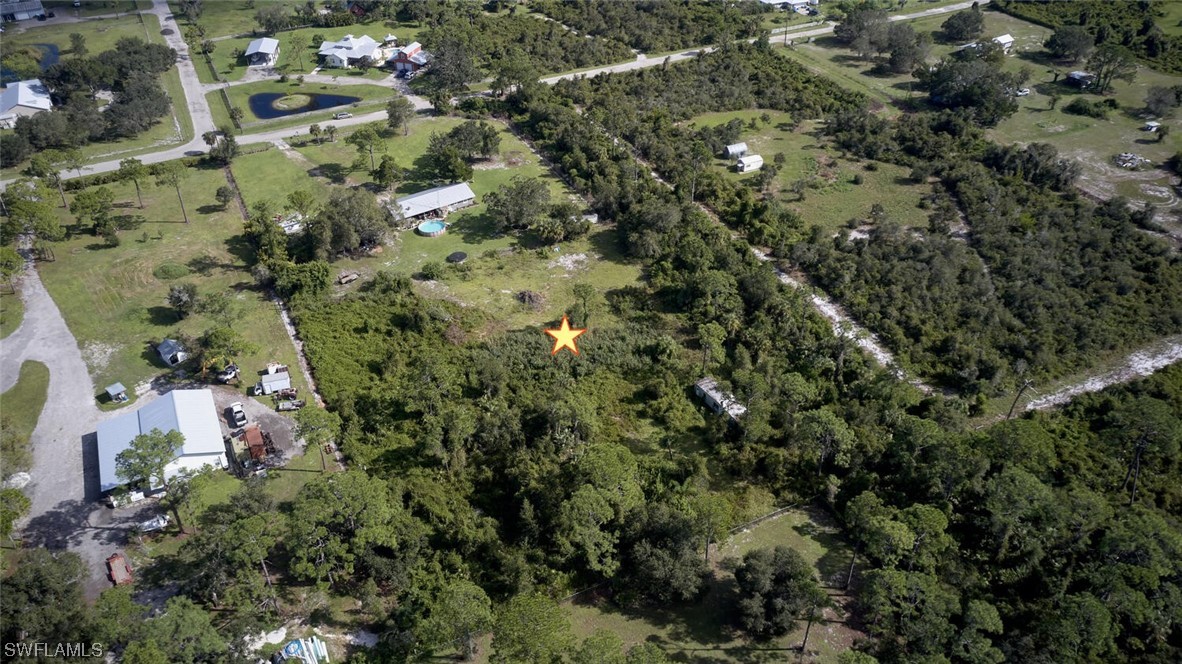21740 Claytor Road Alva, FL 33920 - Photo 10 of 14 an aerial view of residential houses with outdoor space and trees