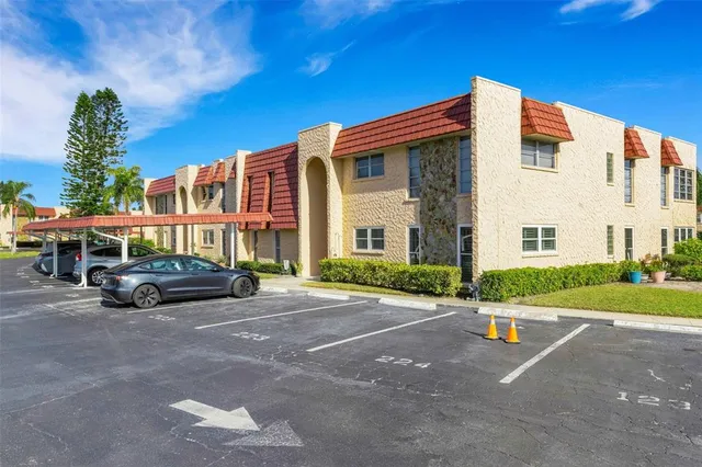 a view of a parked cars in front of a house
