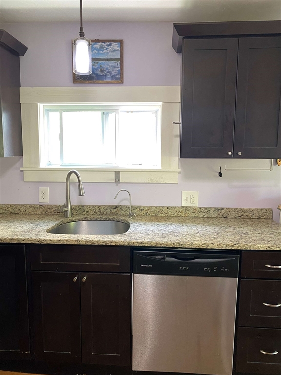 8 May Street Beverly, MA 01915 - Photo 8 of 25 a kitchen with granite countertop a sink and cabinets