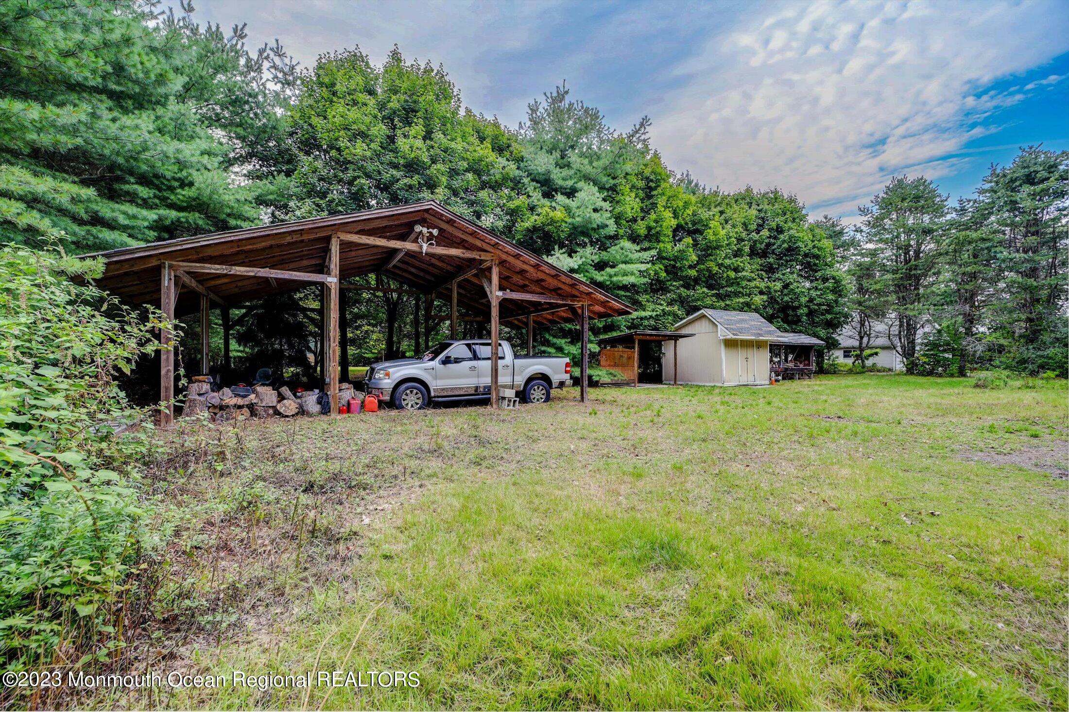 897 Fort Plains Road Howell, NJ 07731 - Photo 23 of 35 a view of a house with backyard and sitting area
