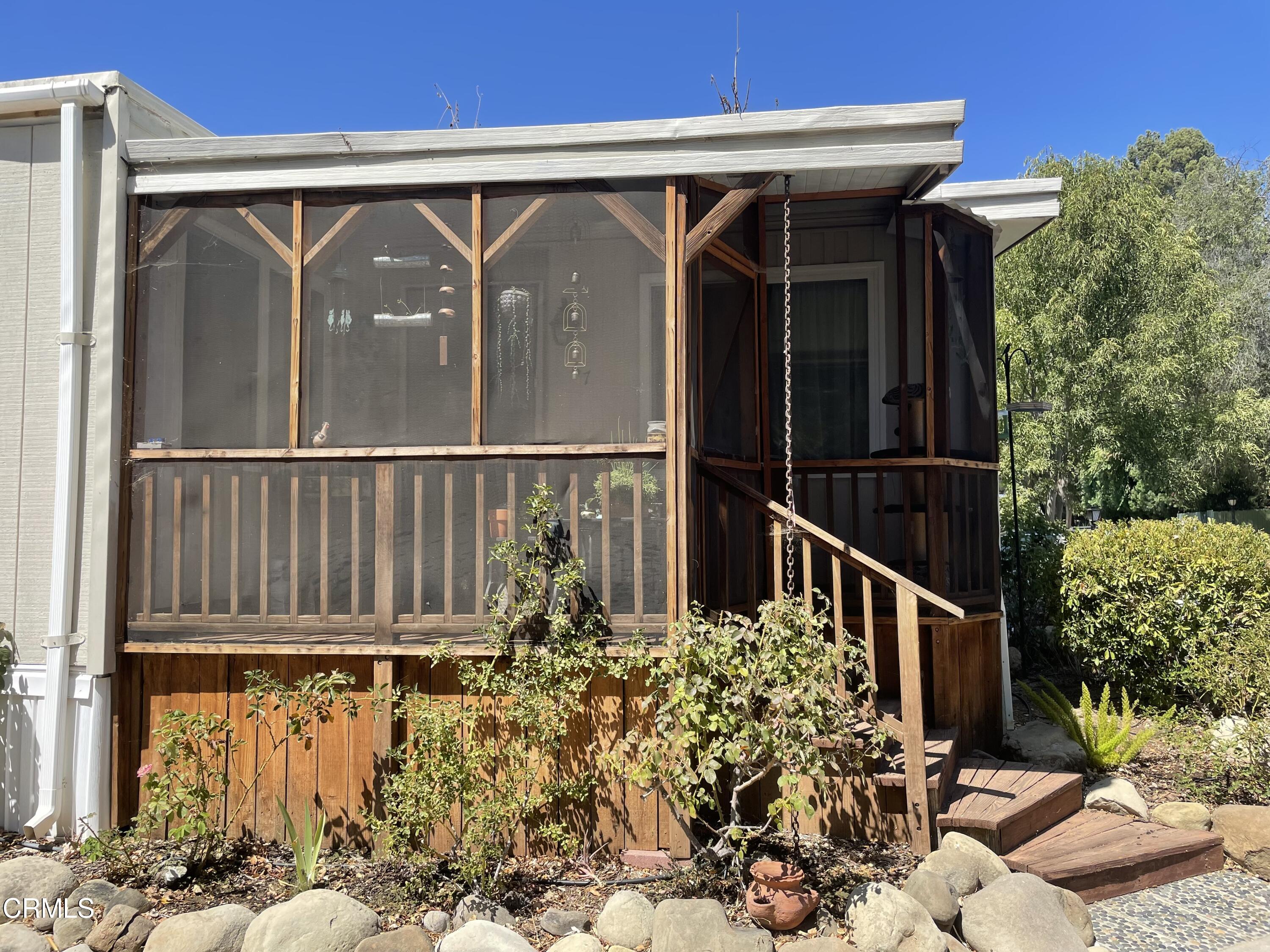 1225 South Rice Road, Unit 67 Ojai, CA 93023 - Photo 3 of 28 a view of a house with a wooden bench