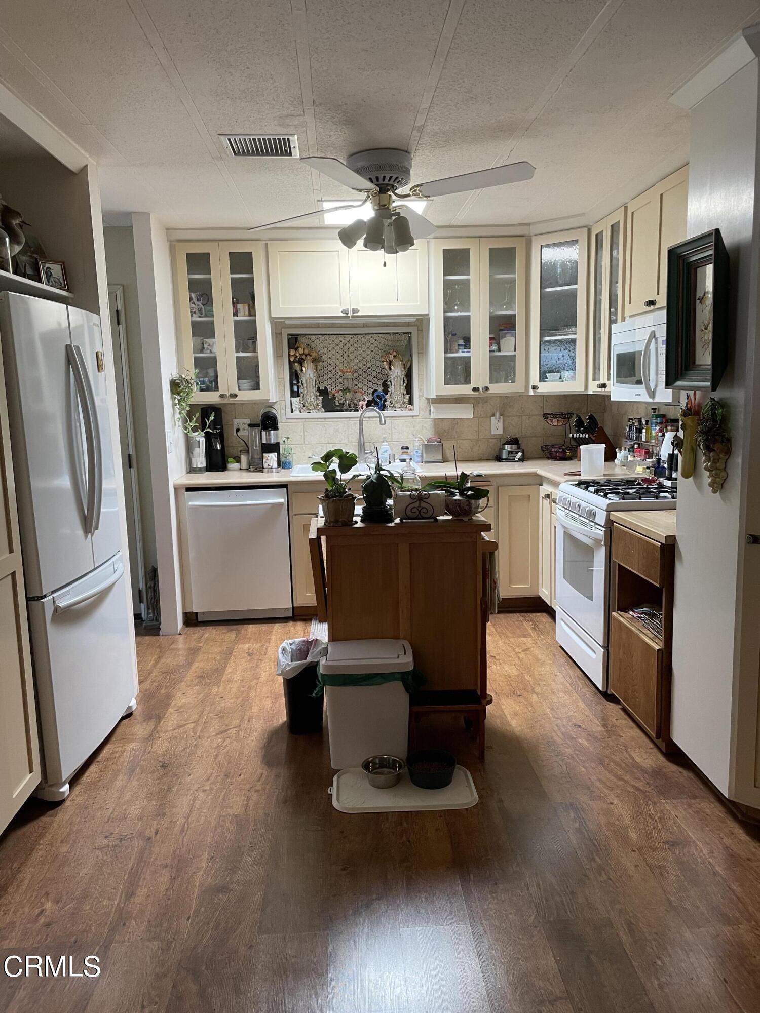 1225 South Rice Road, Unit 67 Ojai, CA 93023 - Photo 6 of 28 a kitchen with a sink stove and refrigerator