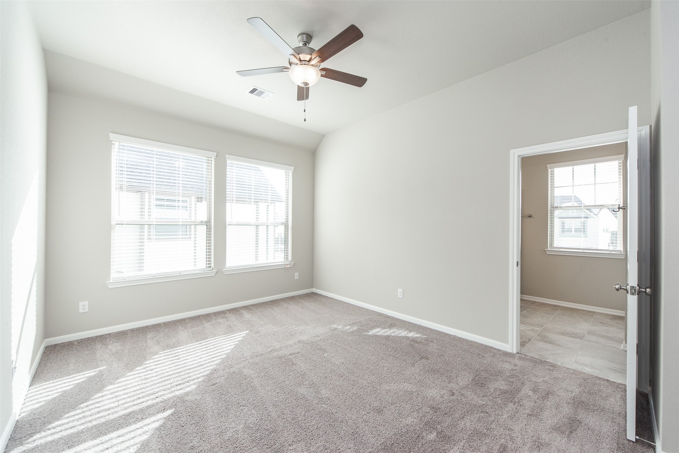 5131 Prairie Terrace Lane Fulshear, TX 77441 - Photo 13 of 21 a view of an empty room with a window