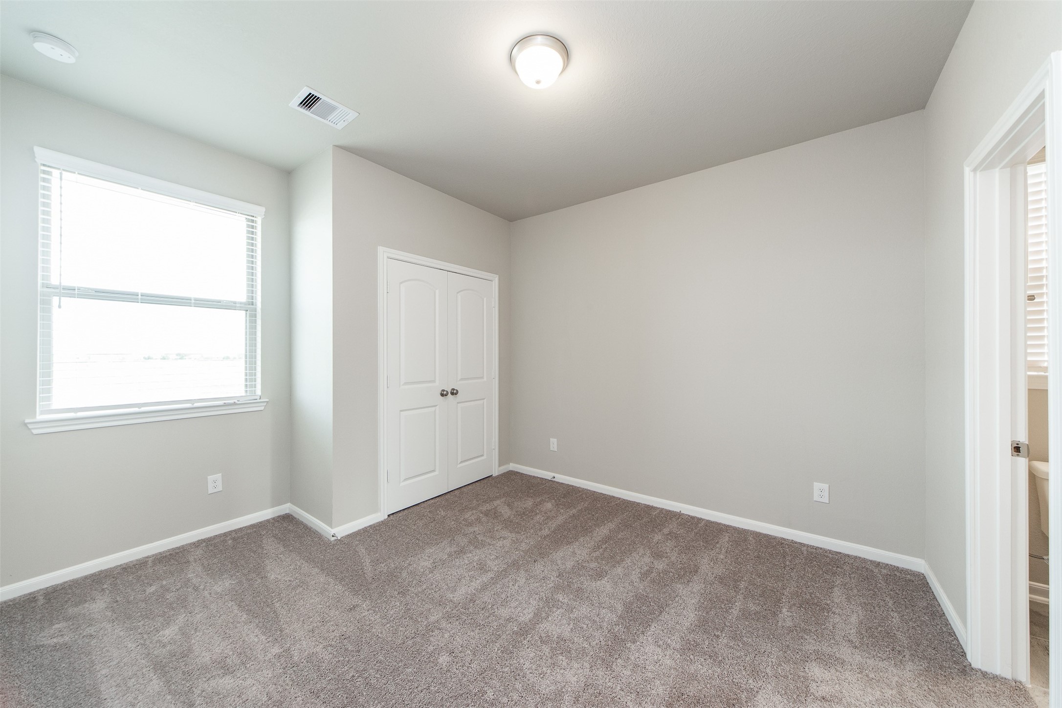 5131 Prairie Terrace Lane Fulshear, TX 77441 - Photo 17 of 21 an empty room with windows and closet