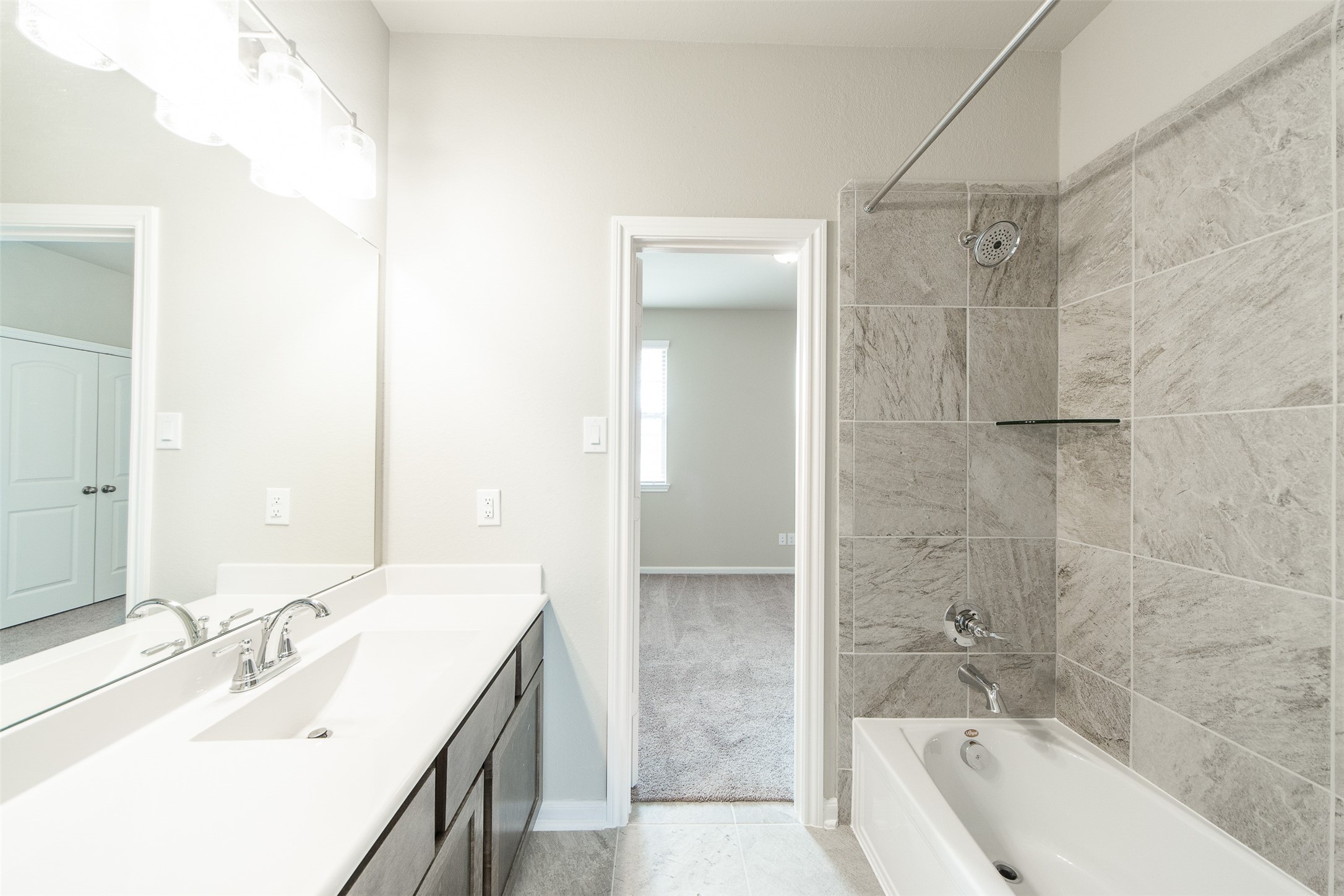 5131 Prairie Terrace Lane Fulshear, TX 77441 - Photo 18 of 21 a bathroom with a bathtub and a sink