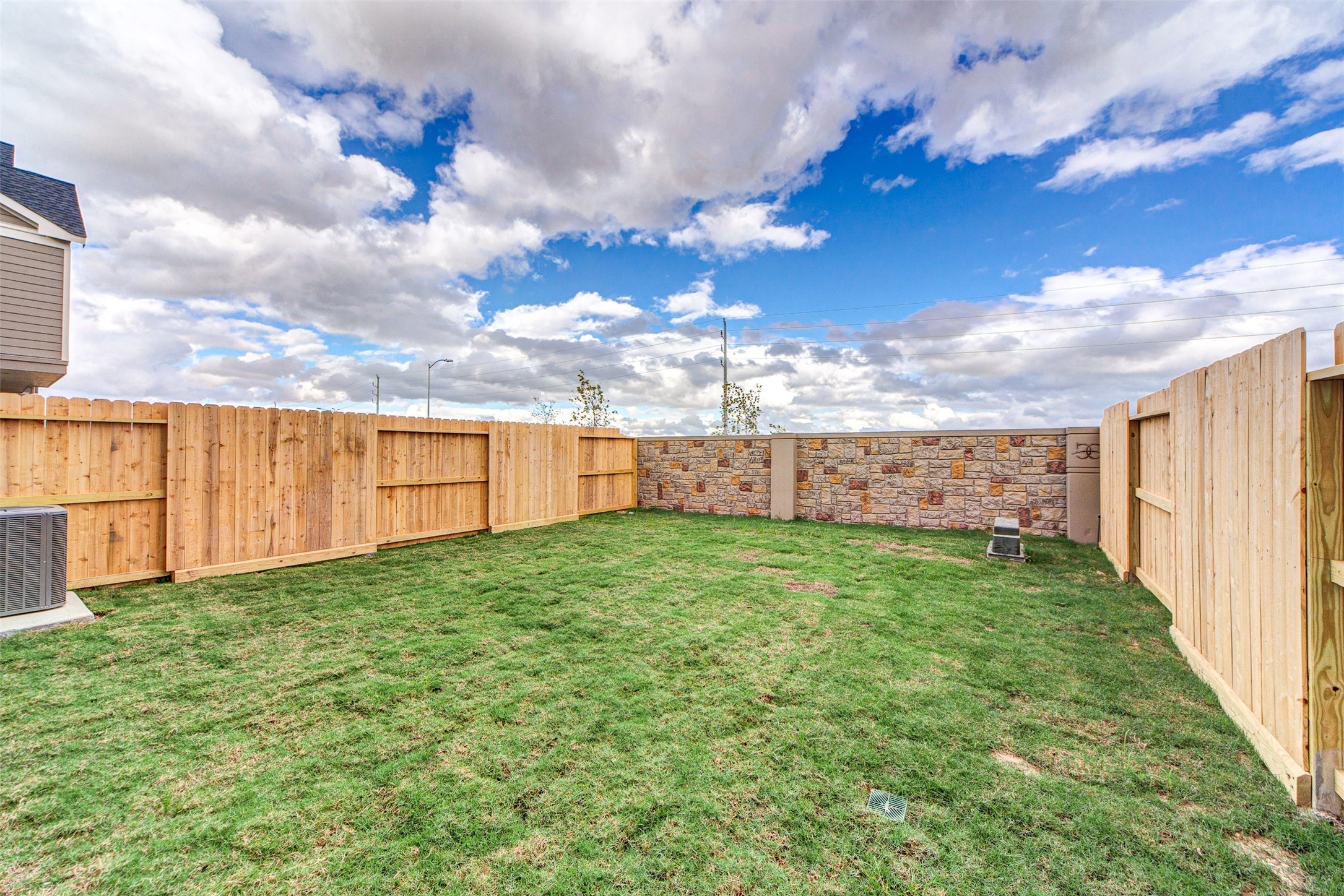5131 Prairie Terrace Lane Fulshear, TX 77441 - Photo 21 of 21 a view of a backyard with barn