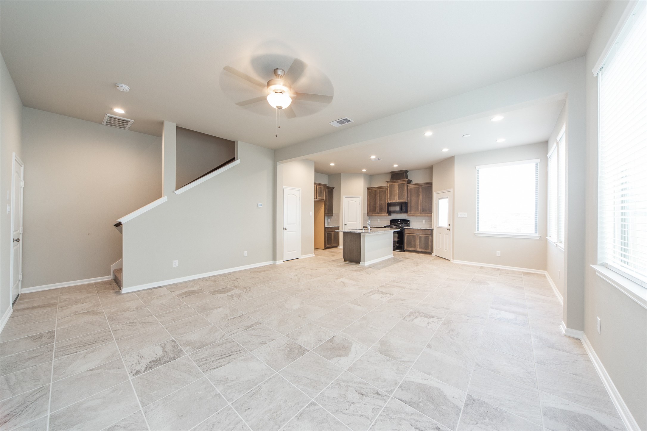 5131 Prairie Terrace Lane Fulshear, TX 77441 - Photo 4 of 21 a view of a kitchen with a sink and a window