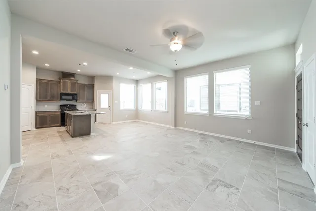 a kitchen with stainless steel appliances a refrigerator and a sink