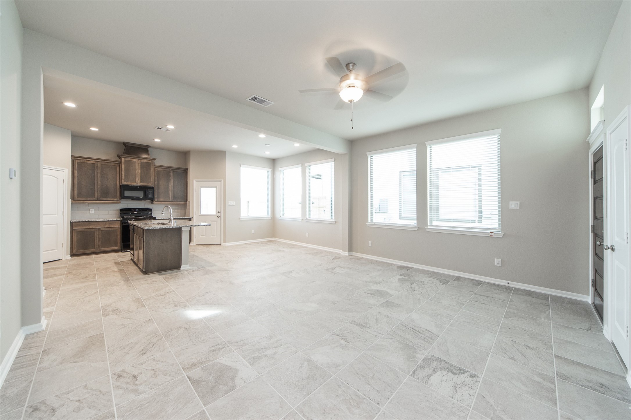 5131 Prairie Terrace Lane Fulshear, TX 77441 - Photo 5 of 21 a kitchen with stainless steel appliances a refrigerator and a sink