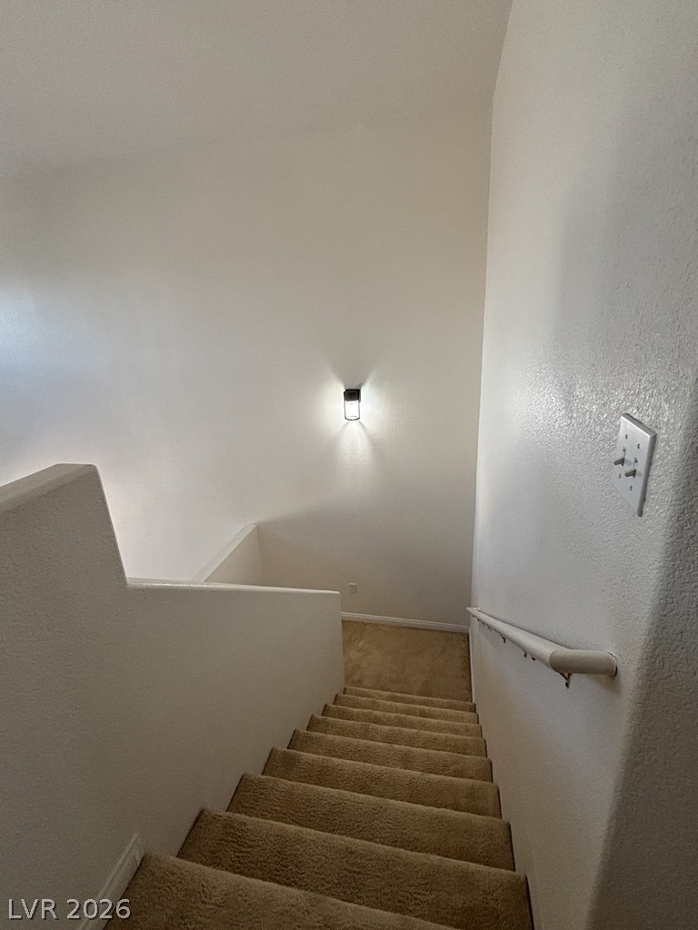 4915 East Russell Road, Unit 130 Las Vegas, NV 89120 - Photo 14 of 14 Stairs featuring carpet floors