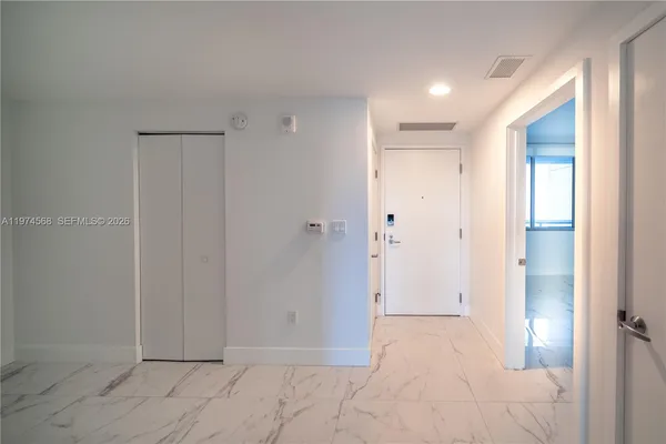 a kitchen with a stove a sink and a refrigerator