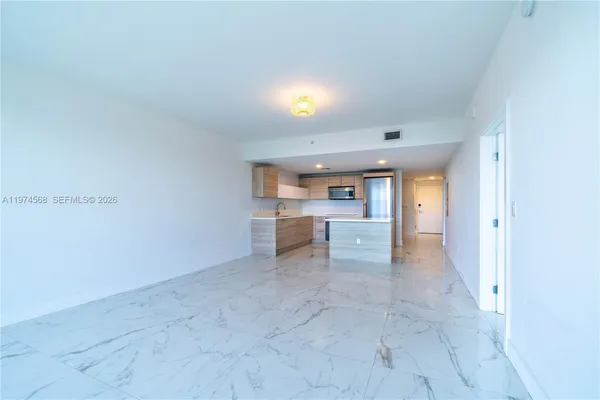 a large bathroom with a large tub and sink