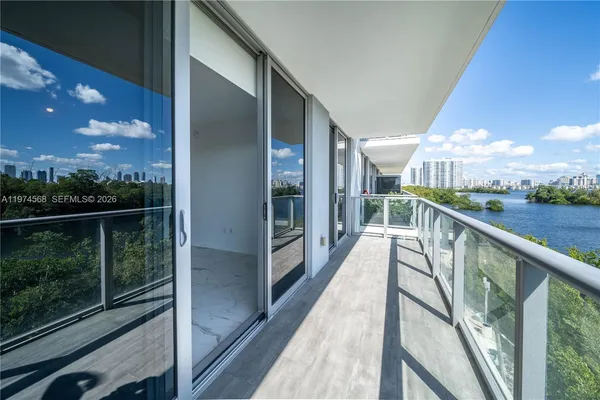 a view of balcony with furniture