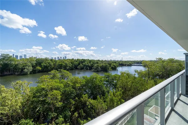 a view of a lake in middle of forest