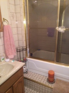644 Rockhurst Road Bolingbrook, IL 60440 - Photo 11 of 11 a bathroom with a sink and a bathtub