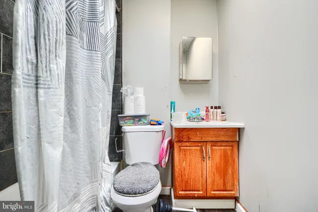 a bathroom with a toilet and a sink