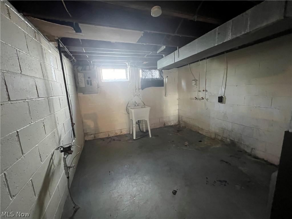 20731 Donnybrook Road Maple Heights, OH 44137 - Photo 14 of 17 Basement with sink and electric panel