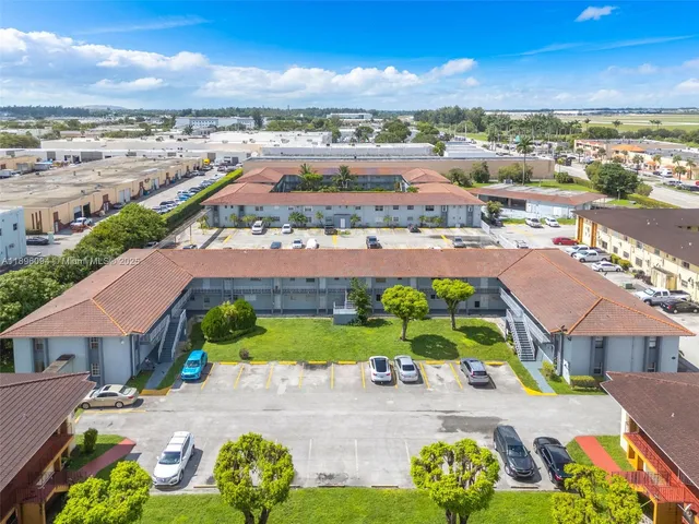 an aerial view of residential houses and outdoor space