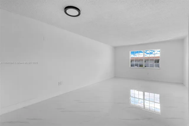 a view of a kitchen with a sink