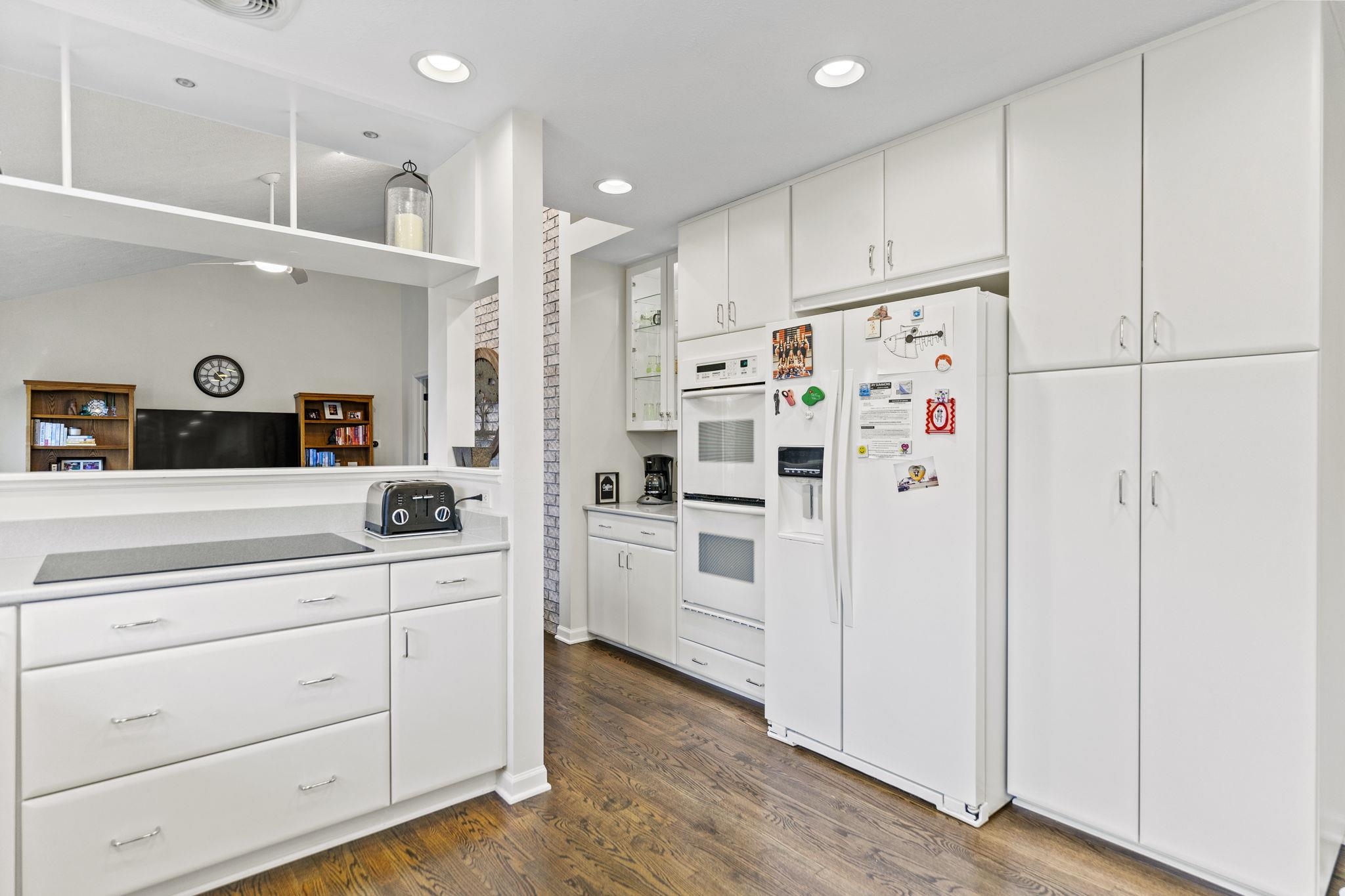 1628 Riverside Road Belvidere, IL 61008 - Photo 14 of 47 a kitchen with white cabinets and white appliances