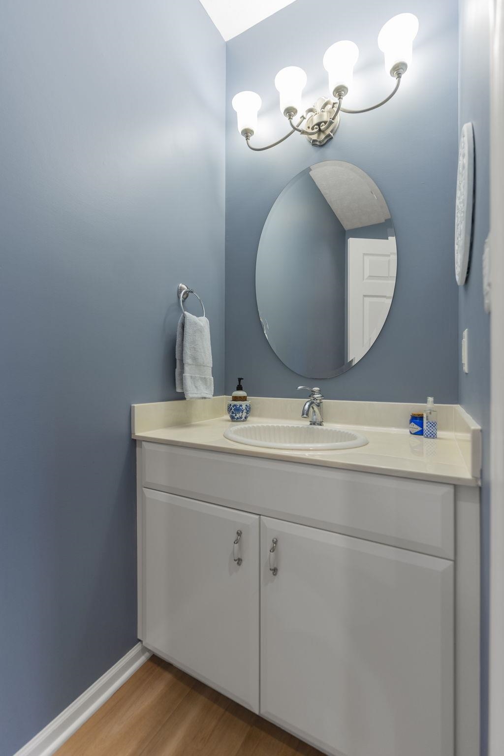 1628 Riverside Road Belvidere, IL 61008 - Photo 18 of 47 a bathroom with a sink and a mirror