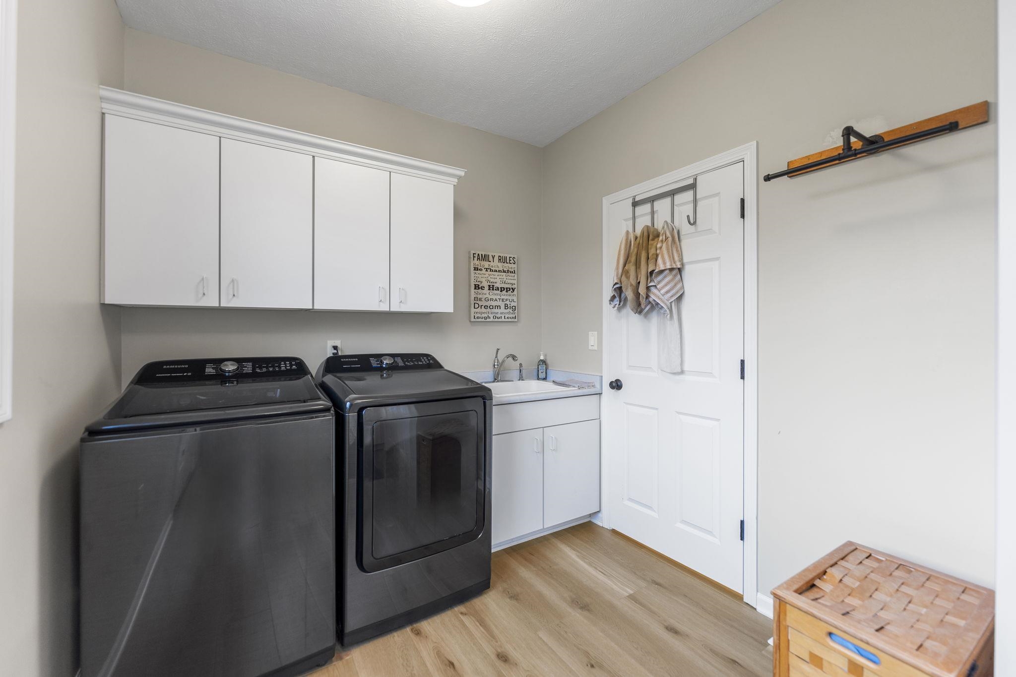 1628 Riverside Road Belvidere, IL 61008 - Photo 19 of 47 a view of a storage and utility room with washer and dryer