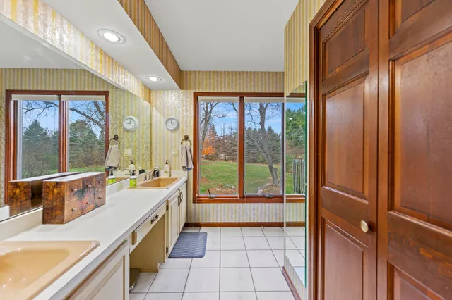 a view of walk in closet with clothes