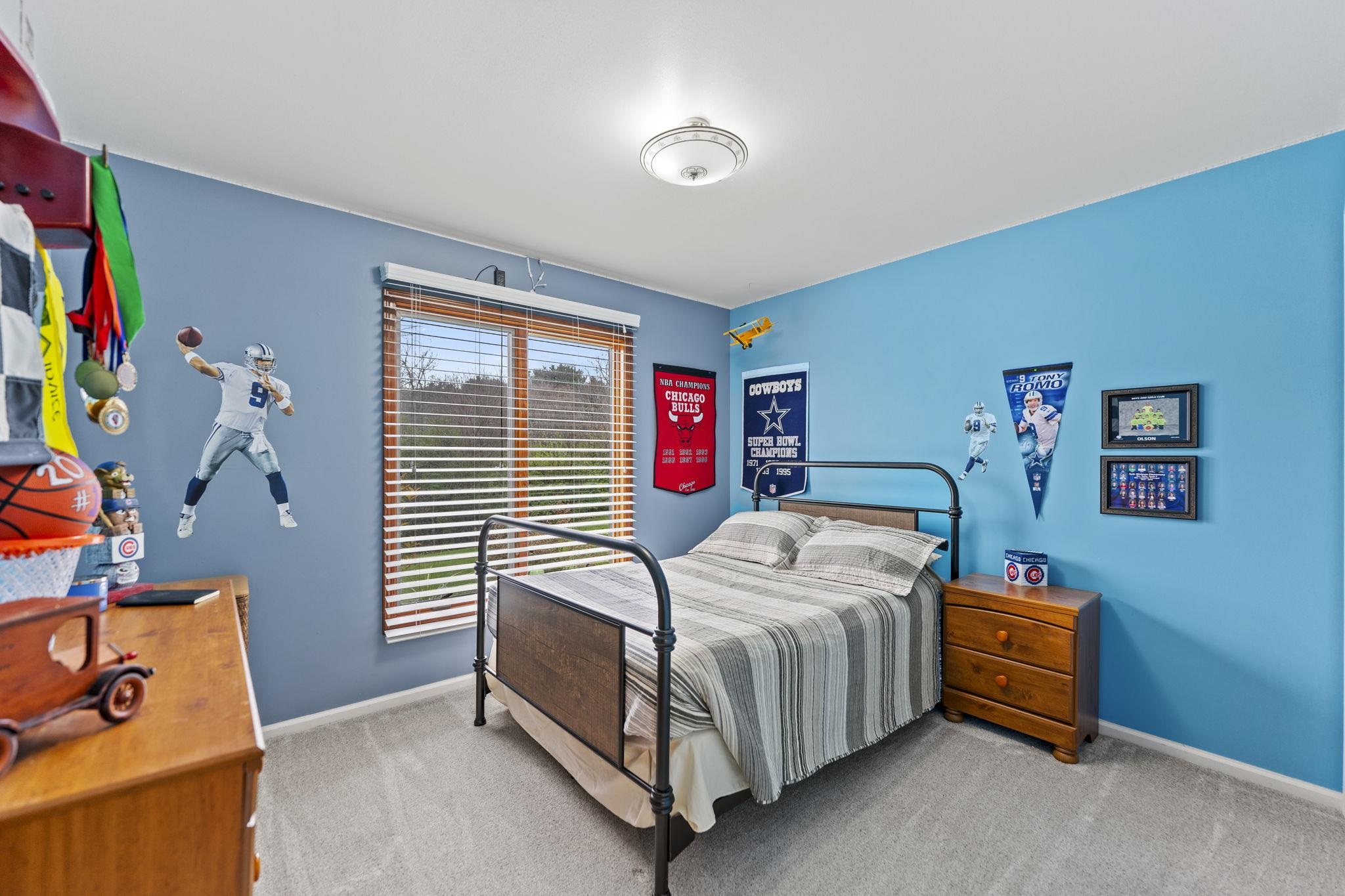 1628 Riverside Road Belvidere, IL 61008 - Photo 26 of 47 a bedroom with a bed and a window