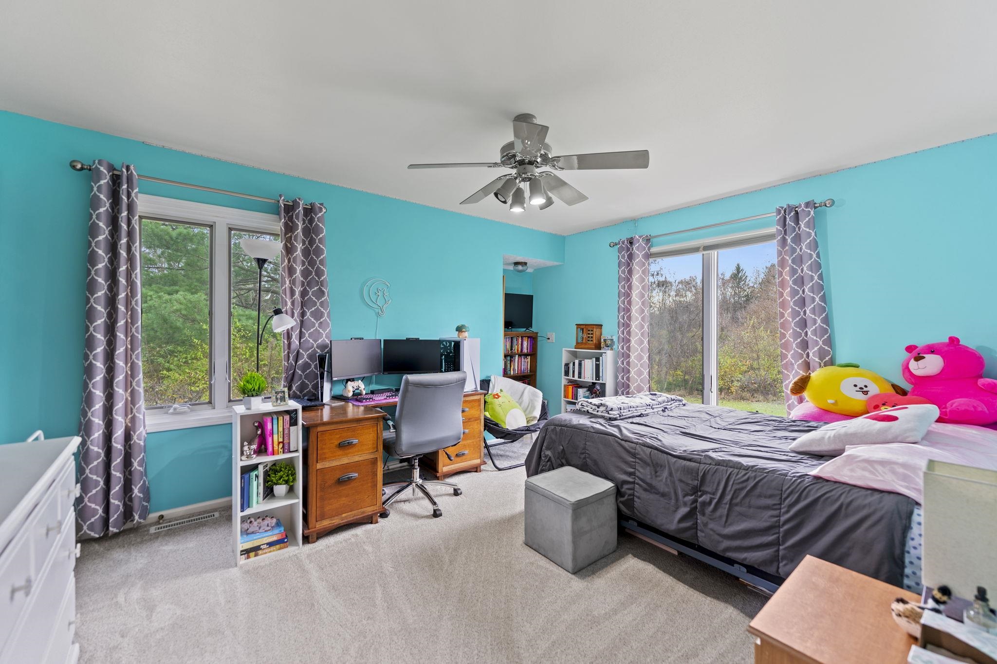 1628 Riverside Road Belvidere, IL 61008 - Photo 27 of 47 a bedroom with a bed and a table