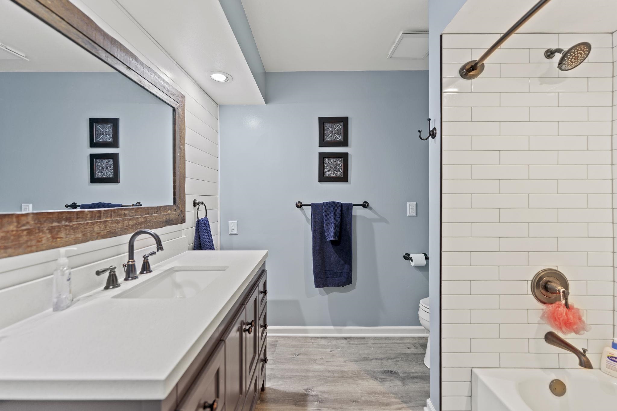 1628 Riverside Road Belvidere, IL 61008 - Photo 28 of 47 a bathroom with a sink and a mirror