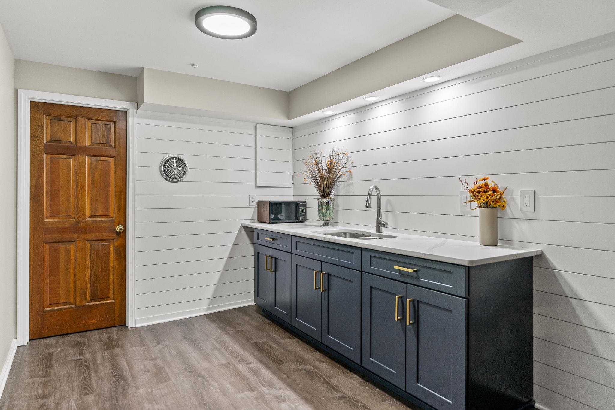 1628 Riverside Road Belvidere, IL 61008 - Photo 29 of 47 a kitchen with stainless steel appliances granite countertop a sink and wooden cabinets
