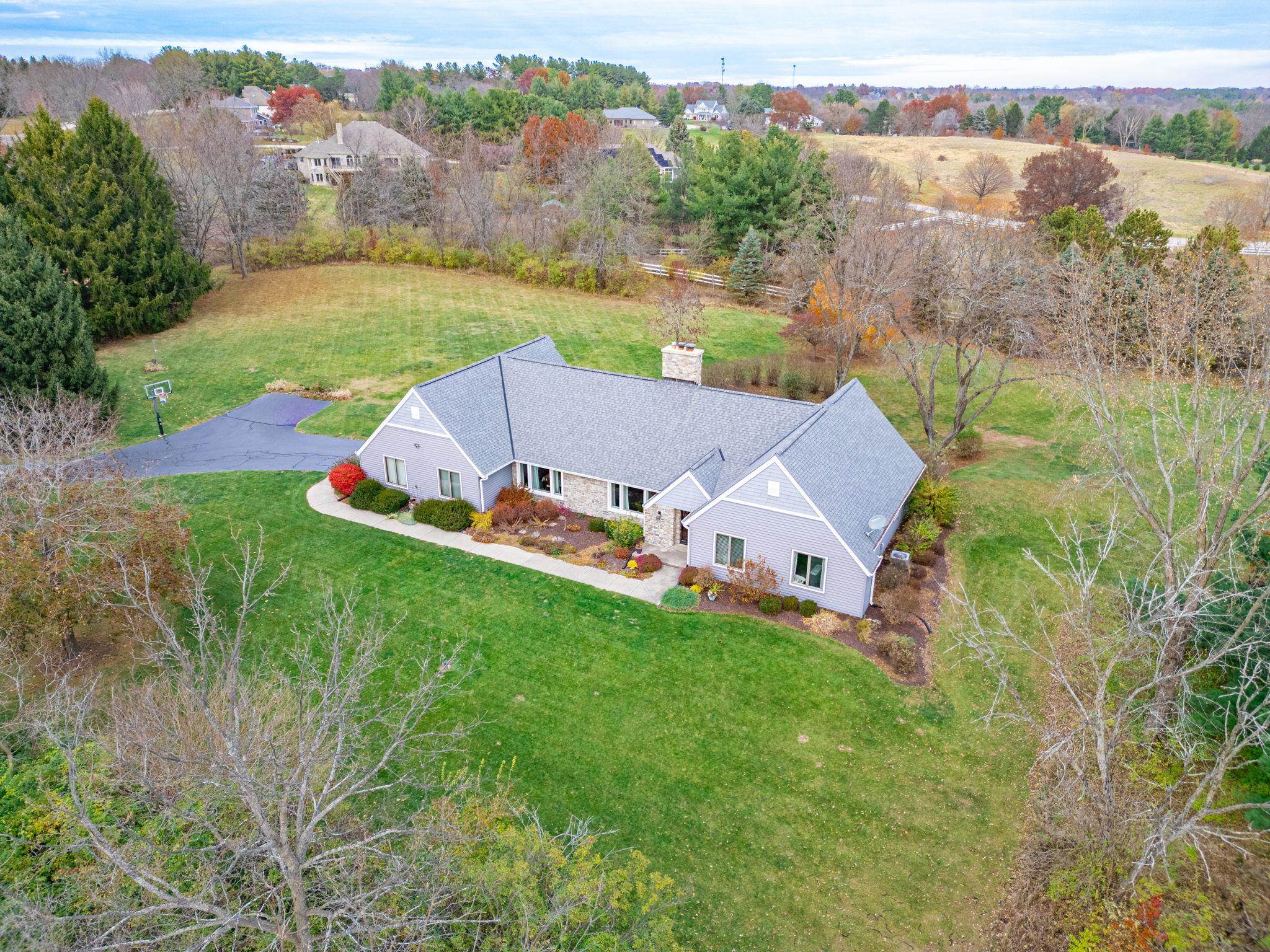 1628 Riverside Road Belvidere, IL 61008 - Photo 3 of 47 an aerial view of residential houses with outdoor space and trees