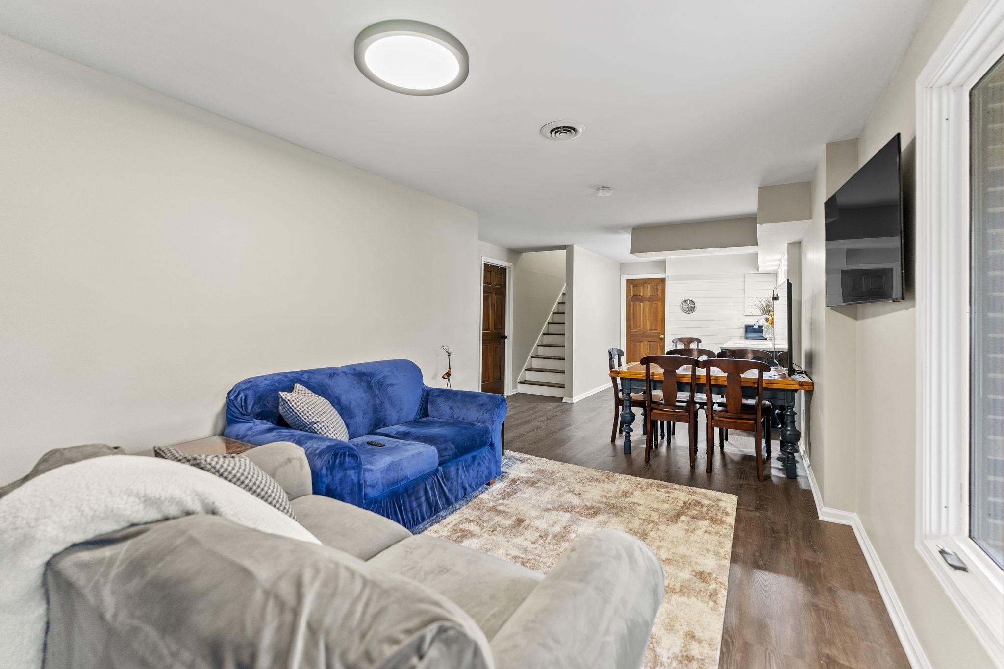 1628 Riverside Road Belvidere, IL 61008 - Photo 31 of 47 a living room with furniture and a flat screen tv