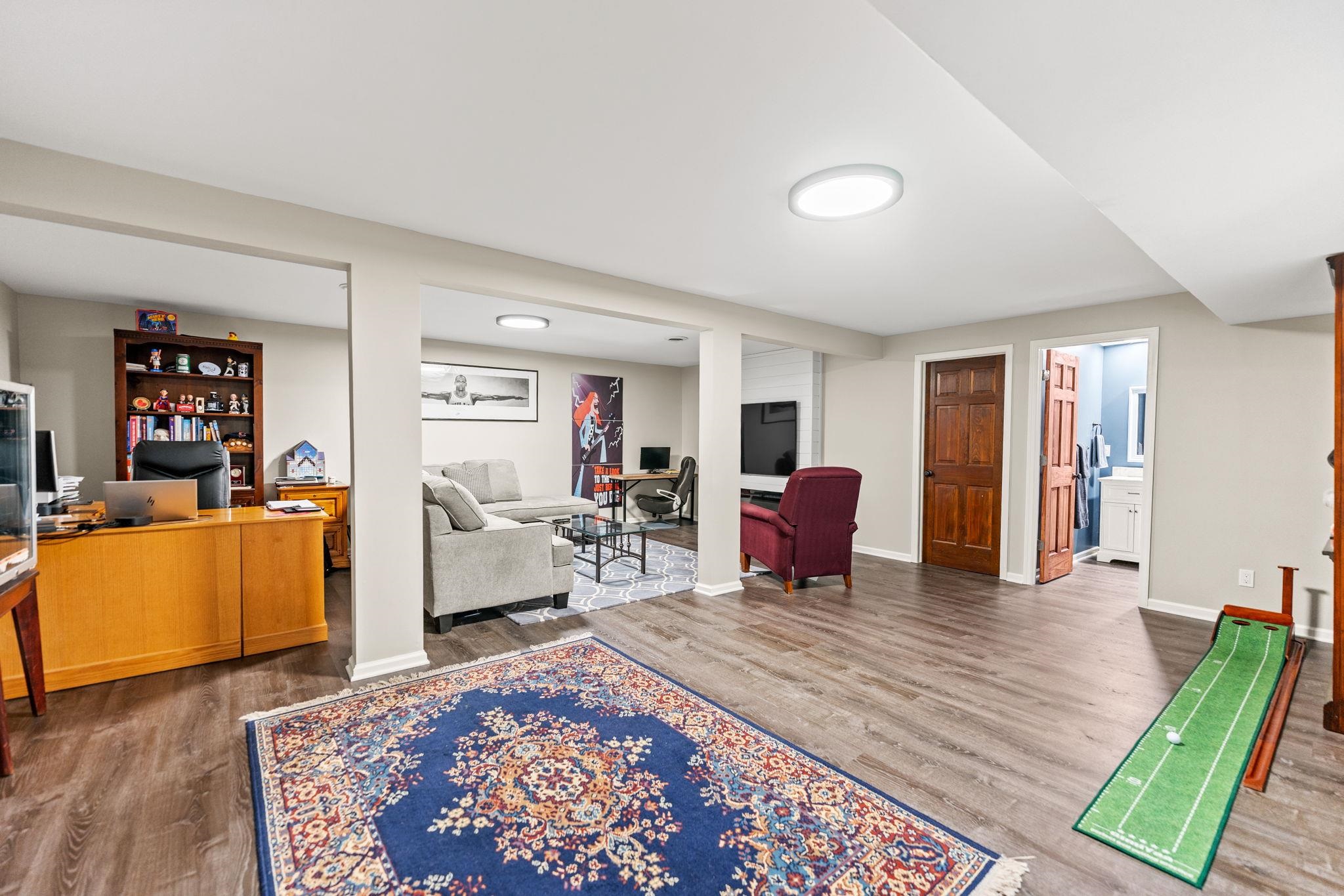 1628 Riverside Road Belvidere, IL 61008 - Photo 32 of 47 a living room with furniture and a wooden floor