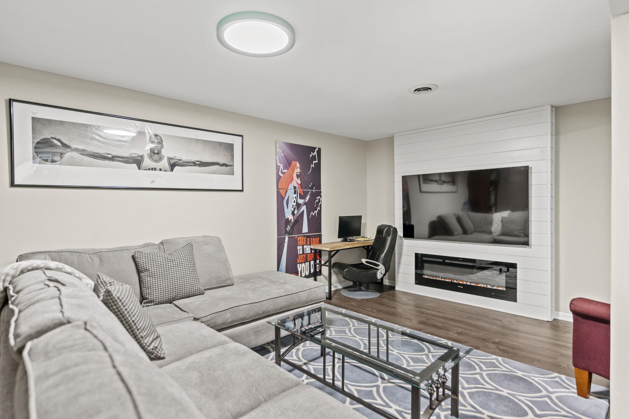 1628 Riverside Road Belvidere, IL 61008 - Photo 34 of 47 a living room with furniture and a flat screen tv