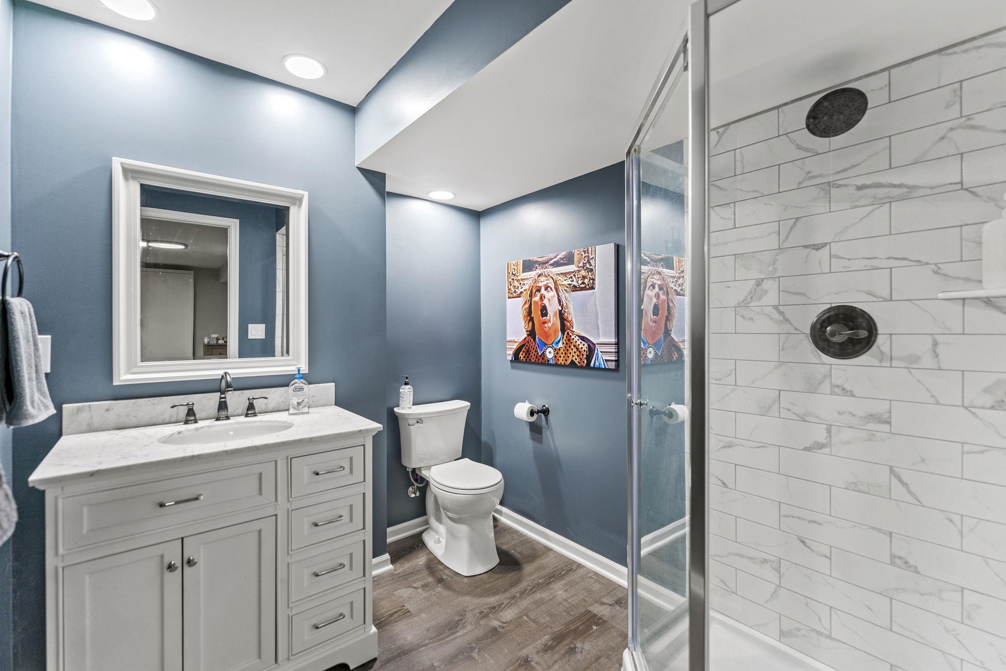 1628 Riverside Road Belvidere, IL 61008 - Photo 35 of 47 a bathroom with a toilet sink and mirror